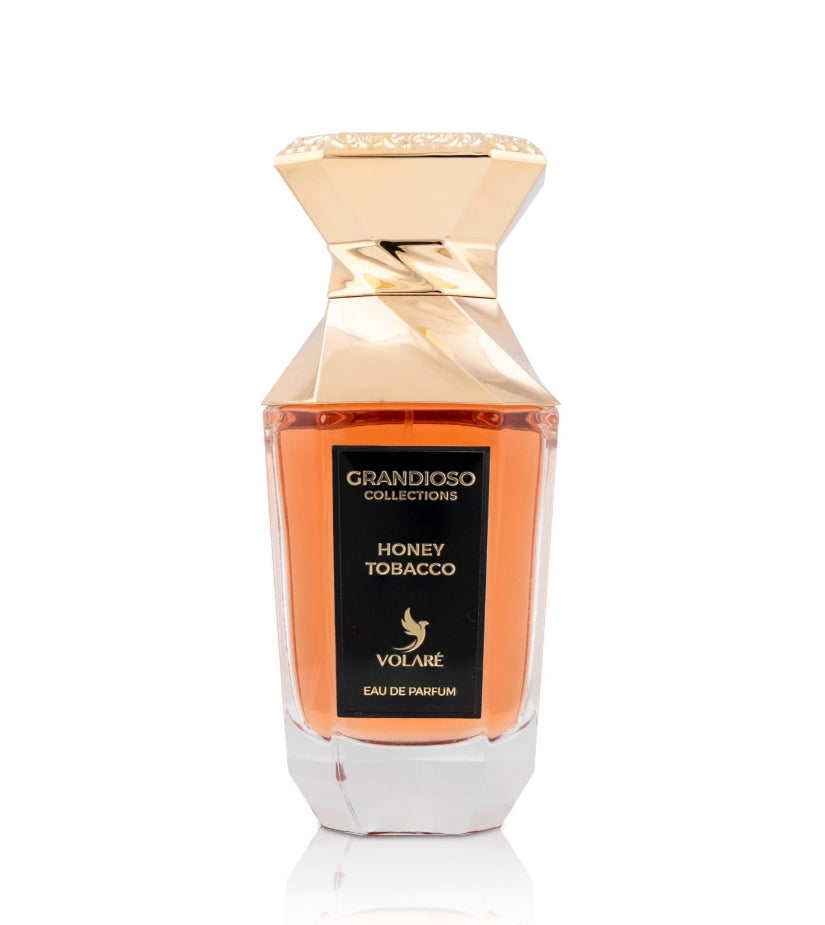 Perfume bottle labeled 'Honey Tobacco' by Volare on a white background